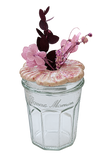 Pink ceramic flower jar with dark leaves, background removed